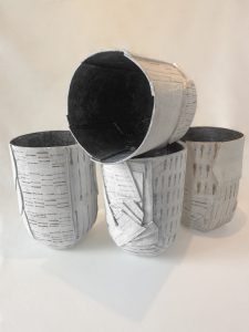 Collection of white slab-built stoneware vessel with graphic patterns, by Alexandra Ridel