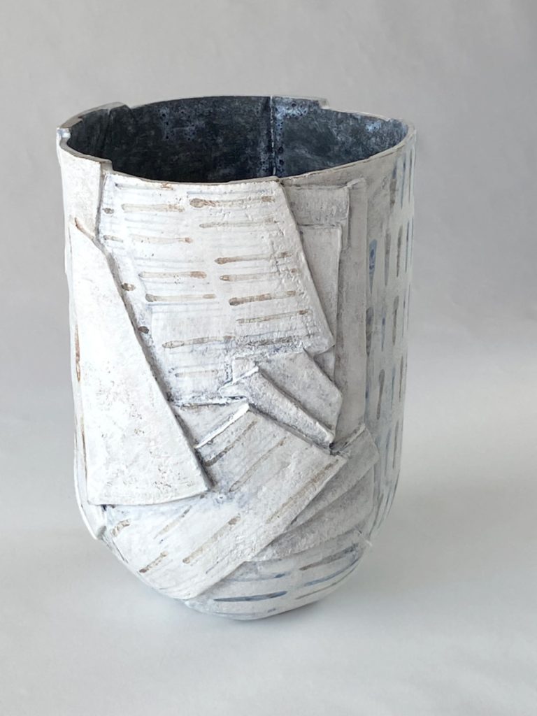 Slab-built stoneware piece with multiple facets, by Alexandra Ridel