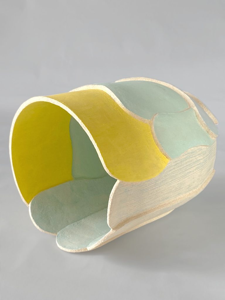 White, pastel green and lemon yellow stoneware vessel, slab-built architectural construction, by Alexandra Ridel