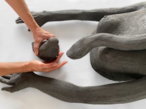  Dark stoneware sculpture of a  dove approaching a snake , by Alexandra Ridel