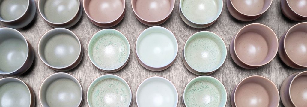 Large collection of colored porcelain cups with satin and microcrystalline glazes, by Alexandra Ridel
