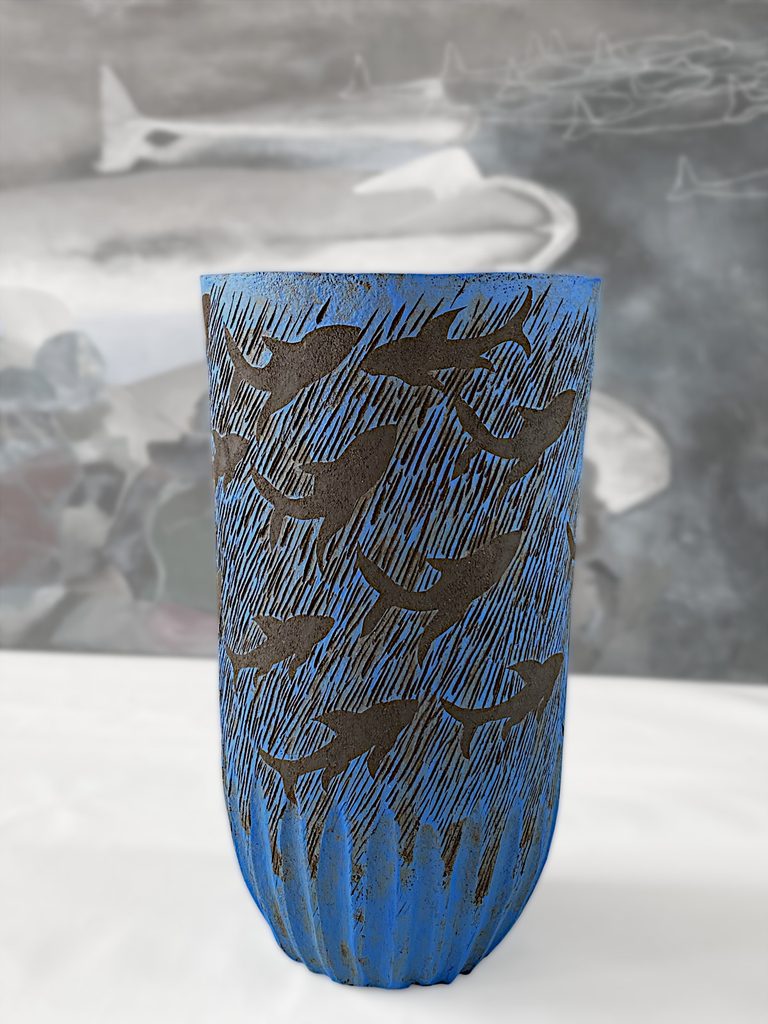 Large sculptural stoneware vessel depicting sharks swimming against a deep blue background, by Alexandra Ridel