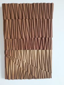 Wall composition in brown stoneware with shades of light by Alexandra Ridel