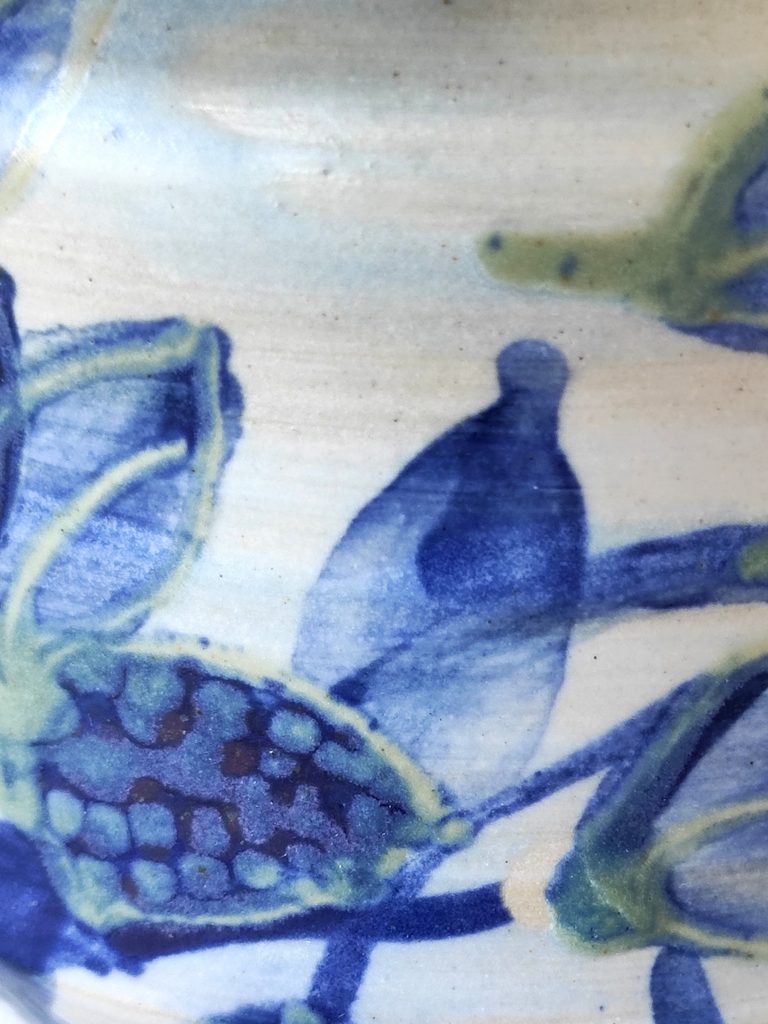 Detail of a cobalt blue botanical decoration on stoneware, by Alexandra Ridel