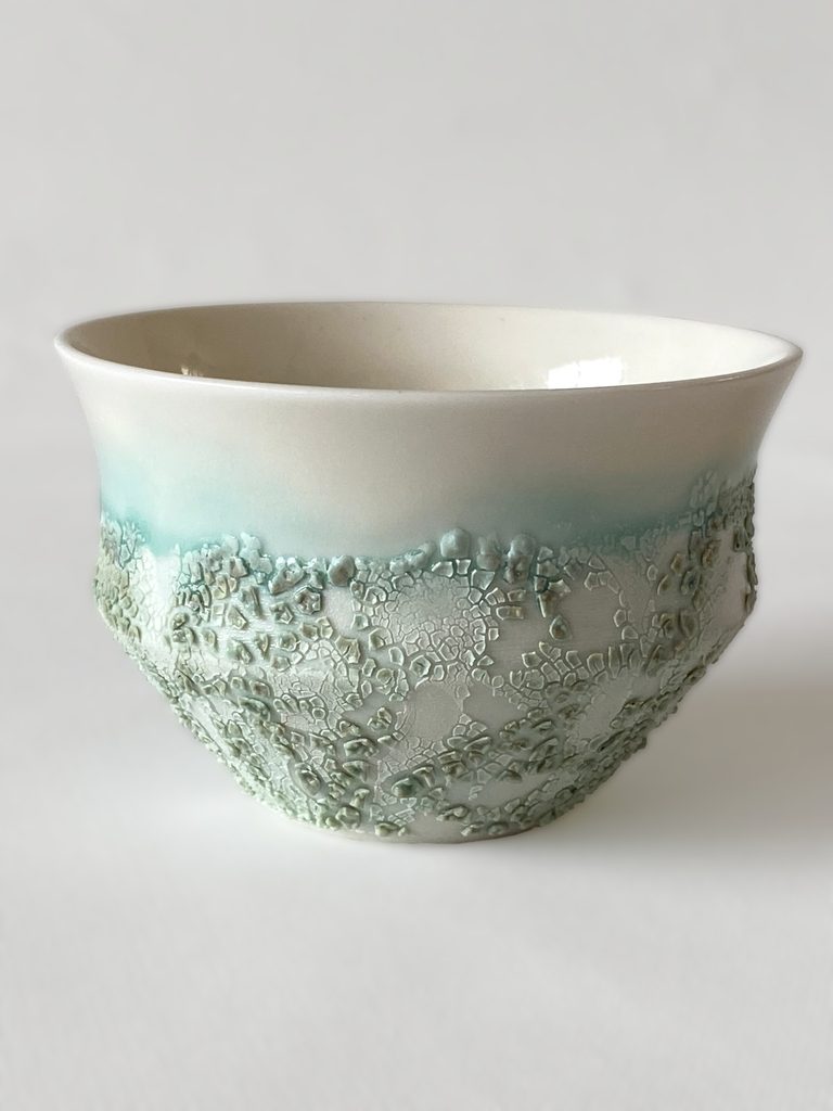 White porcelain bowl with a green crawling glaze effect, by Alexandra Ridel