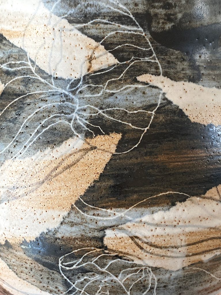 Detail of a jellyfish motif on a stoneware vessel, by Alexandra Ridel