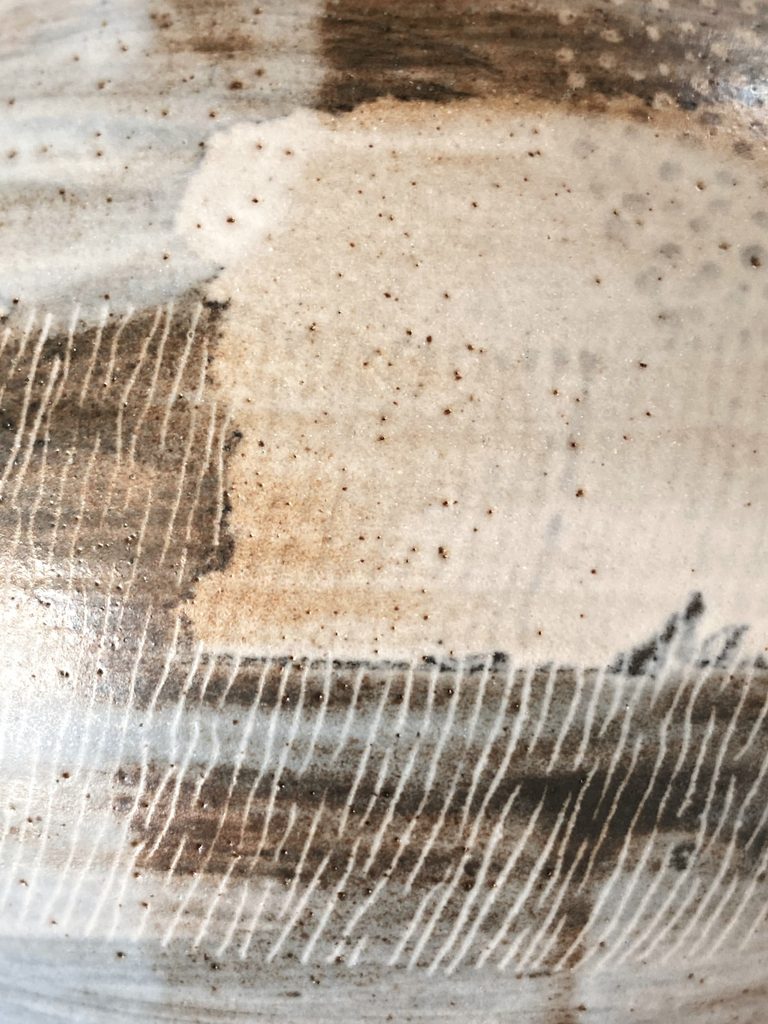 Detail of a graphic motif on a stoneware vessel, by Alexandra Ridel