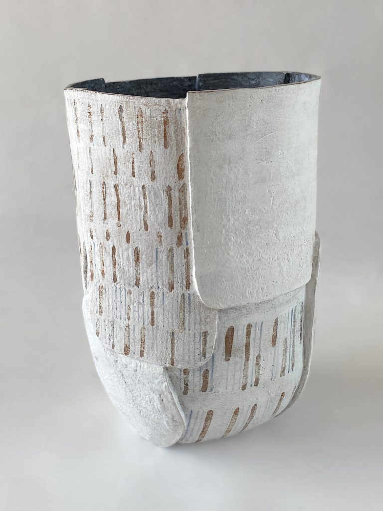 Slab-built stoneware volume with patchwork motifs on a white background, by Alexandra Ridel