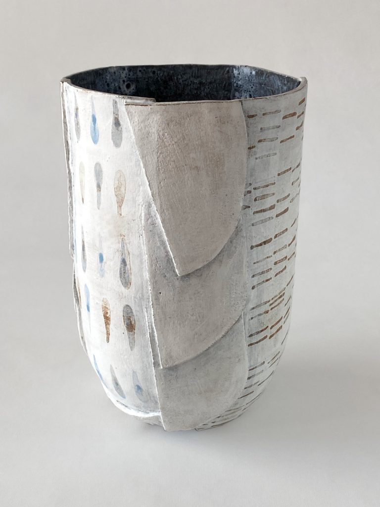 slab-built stoneware volume with graphic motifs on a white background and dark interior glaze by Alexandra Ridel