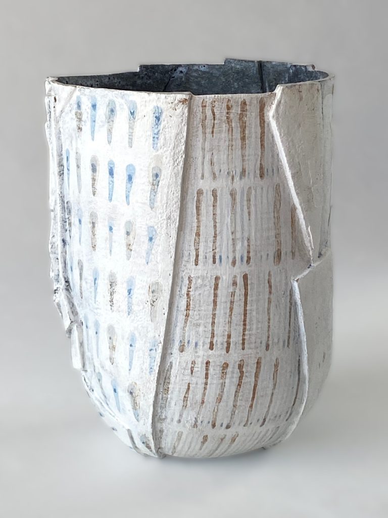 slab-built stoneware volume with blue and grey patterns on a white background by Alexandra Ridel