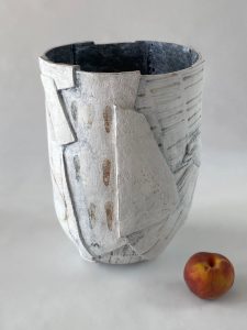 White slab-built stoneware vessel with drop and line motifs, by Alexandra Ridel